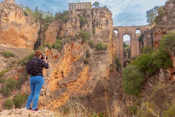 Ingelijste posters Ronda Puente Nuevo Tourist Photographing Puente Nuevo in Ronda, Spain  © pillerss