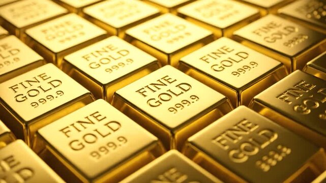 Close-up of rows of rectangular gold bars, stamped with "FINE GOLD 999.9" for investment