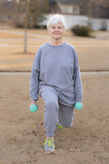 Senior woman performing lunge exercise for balance and strength