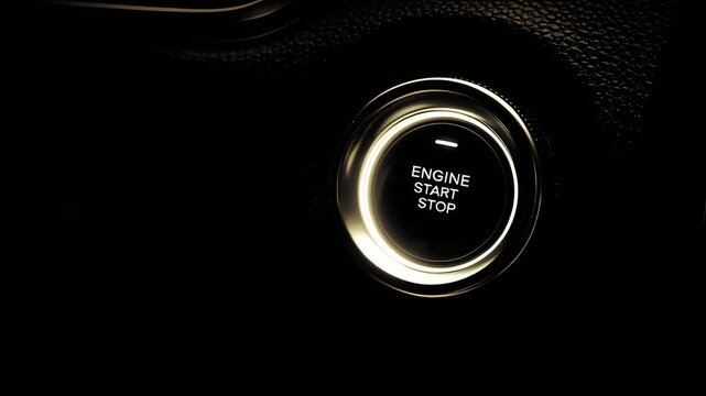 Close-up of a glowing engine start-stop button in a dark car interior, highlighting modern automotive technology.