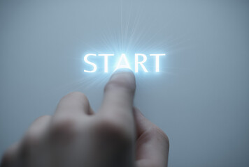 a hand pressing finger at the glowing word "start" on a white background