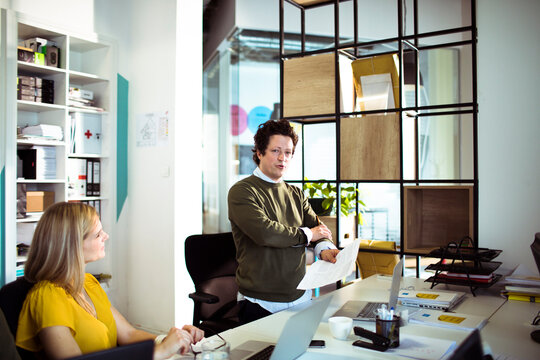 Business team discussing presentation in modern office