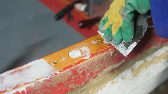 Applying polyester filler to fiberglass boat gunwale