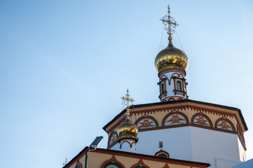 Obraz premium Beautiful Christ cross decorated on the top of an Orthodox church in Irkutsk, Russia. Orthodoxy believes that the Christian Faith and the Church are inseparable.