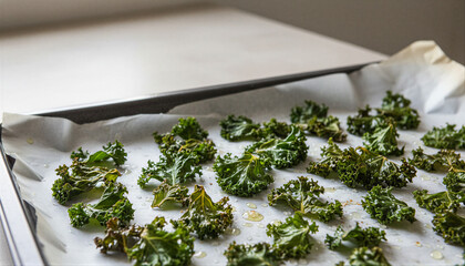Fresh green kale leaves with olive oil and salt on a baking sheet, preparing healthy vegan snack concept for nutritious and clean eating