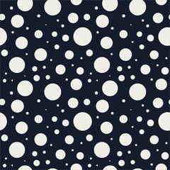 Seamless polka dot pattern in navy and icy blues with off-white dots. Fresh modern repeat for textiles, wallpaper, packaging, gift wrap, stationery and surface design.