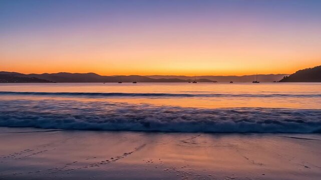 Golden sunset over a tranquil beach with gentle waves and distant horizon.