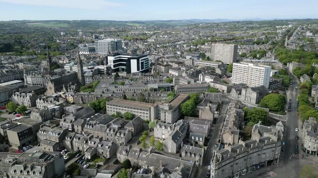 High altitude drone shot scanning the historic granite architecture of Aberdeen city including the St Mary of the Assumption Cathedral.