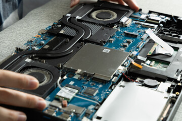 Repair Process of a Laptop With Hands Working on the Internal Components of the Device
