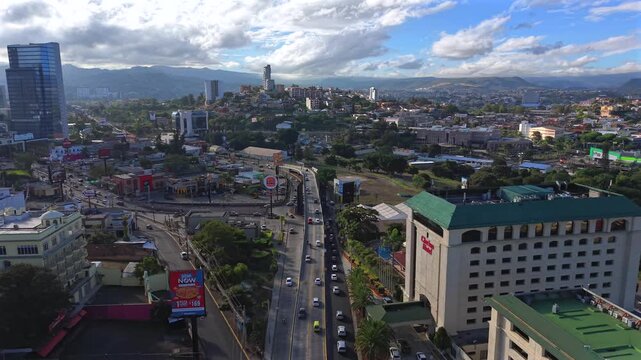 Beautiful aerial night view of Tegucigalpa, capital of Honduras and Comayaguela, surrounded by mountains and the city glowing across the urban valley
