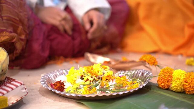 Hindu men performing a ritual for a rice ceremony event in India