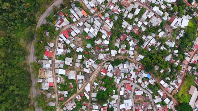Beautiful aerial night view of Tegucigalpa, capital of Honduras and Comayaguela, surrounded by mountains and the city glowing across the urban valley