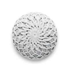A white crocheted round decorative item viewed from above on a plain surface.