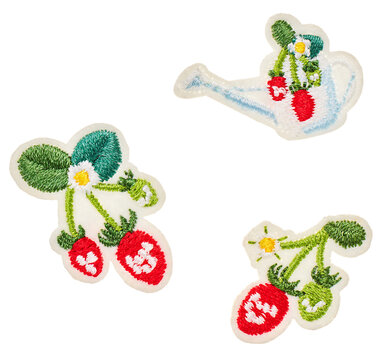 Set of colorful embroidery patches with strawberry, watering can, and daisy flowers, isolated on white background, PNG