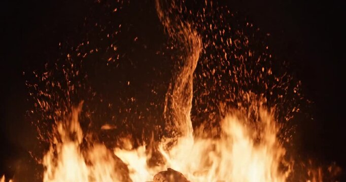 Burning wood at night time.