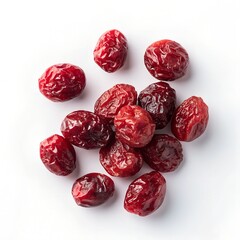 dried cranberries scattered on a white background close up