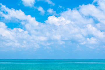 Obraz premium A bright, clear blue sky meets a glowing white horizon, suggesting a serene, open, and with sunlight of beautiful cloudy sky. landscape or abstract background 