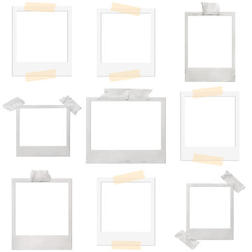 a charming collection of blank vintage polaroid instant photo frames, many secured with classic tape, isolated on black.