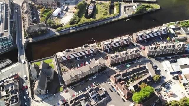 Drone over Ringsed, River Dodder in Dublin City Centre, sunny day. Residential buildings.