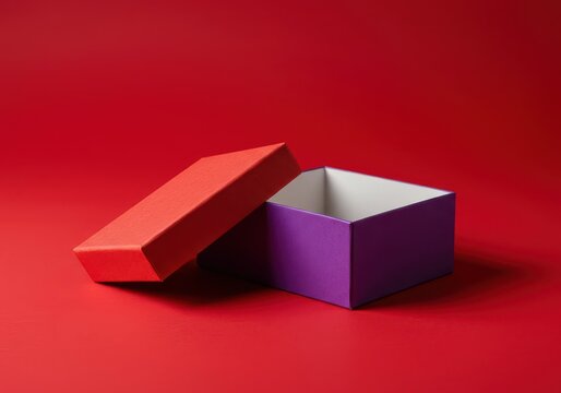 Scatola regalo colorata aperta e vuota su vibrante sfondo rosso, ideale per annunci festivi e celebrazioni, event, advertising, crimson
