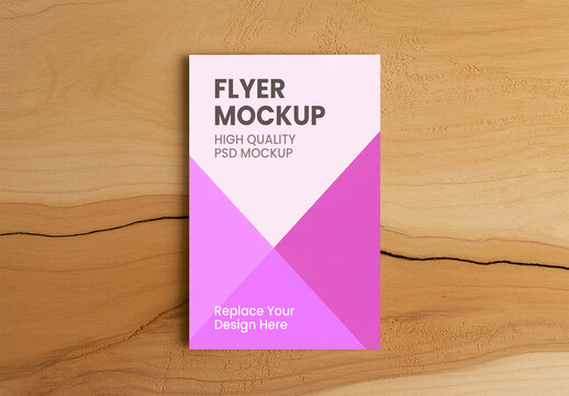 Vertical Flyer Mockup on Natural Wooden Desk