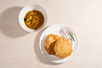 Aloo Puri or Potato curry with fried Poori, popular Indian breakfast, lunch, dinner menu.
