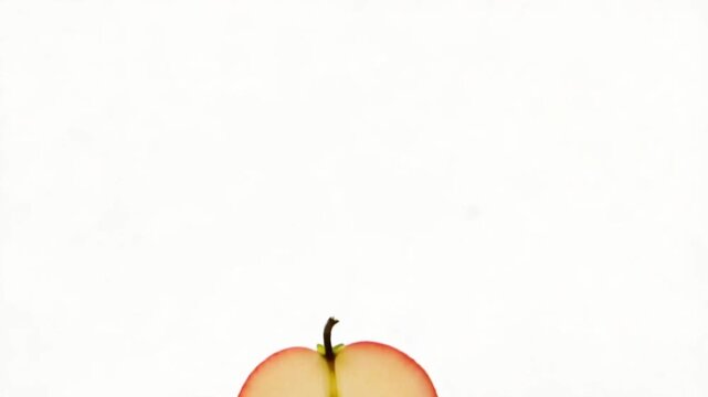 Sliced Apples Falling in Air.