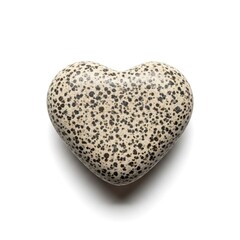 Heart shaped speckled stone polished smooth with natural dark spots resting alone against a clean bright white background in studio light.