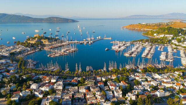Bodrum, Turkey. Scenic coastal view from shore of Gokova Bay with Bodrum Castle, yacht marina, mountains and white houses in foreground.. Aerial View
