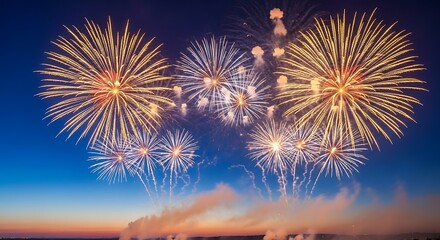 Vibrant fireworks explode across a clear blue twilight sky
