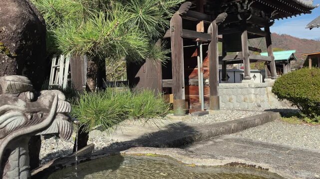 Temizuya dragon fountain basin at Buddhist temple in mtns of Japan