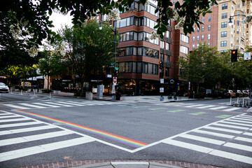 Naklejka premium Rainbow painted bike lane with Pride colors on urban street in Washington DC, USA. g.