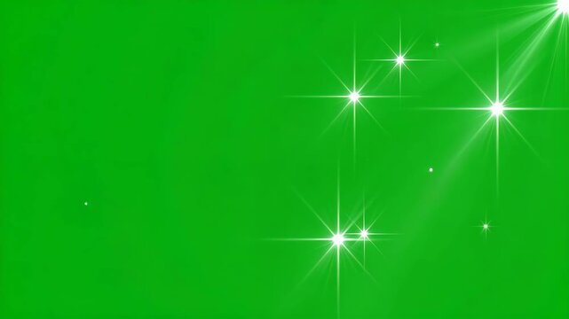 Sparkling bright light flares and starbursts against a solid green background