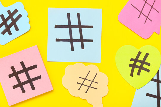 Sticky notes with hashtags on yellow background