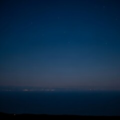 Fototapeta premium Dark blue sky with distant lights.