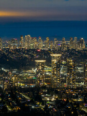 Naklejka premium Night City Skyline With Bright Lights Over Burnaby Downtown, Canada