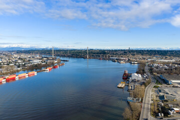 Aerial View Of Fraser River Delta Bridge And Industrial Waterfront In Delta, BC, Canada