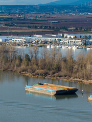 Fototapeta premium Fraser River Delta Waterfront With Boats, Docks And Industrial Buildings In Delta, BC