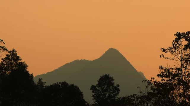 4K wide landscape shot of silhouette mountains during sunset in H&agrave; Giang , Vietnam 