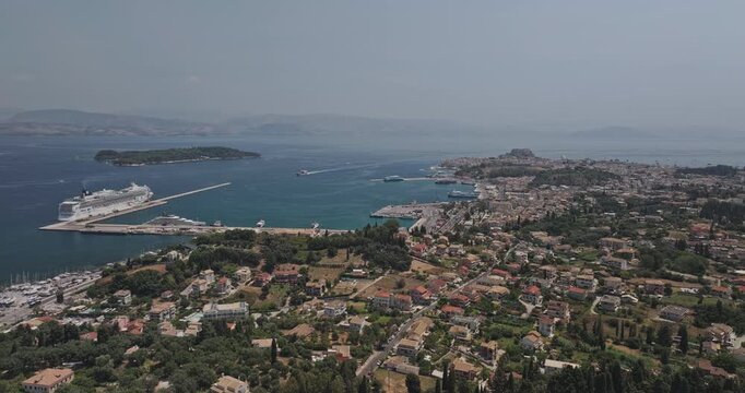 Corfu Greece Aerial v22 panoramic flyover Kefaloumantouko hillside capturing port harbor, charming townscape, views of airport and island - Shot with Mavic 3 Pro Cine - July 17th 2024