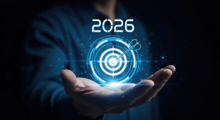 Fototapeta premium A futuristic vision of 2026 with a glowing blue target in a person's hand
