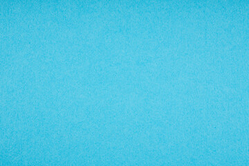 Cyan blue ribbed paper texture background with bright vertical lines and textured surface for school or office supplies design