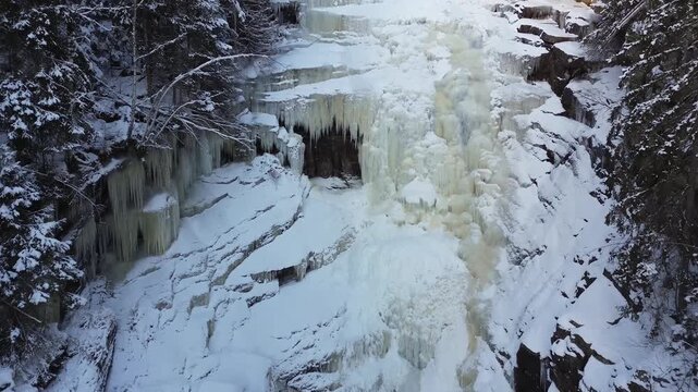 Central Aerial View of Solbergfossen Waterfall in Winter Forest, Norway