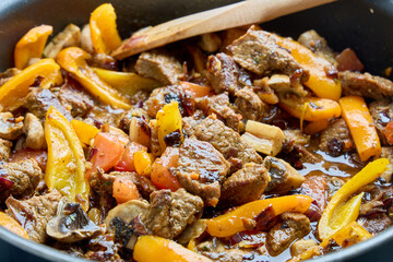 Homemade Beef Stir Fry Cooking in Pan with Peppers