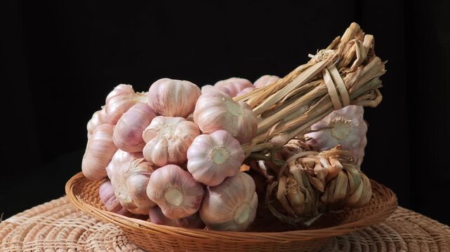 Fresh garlic on a black background.