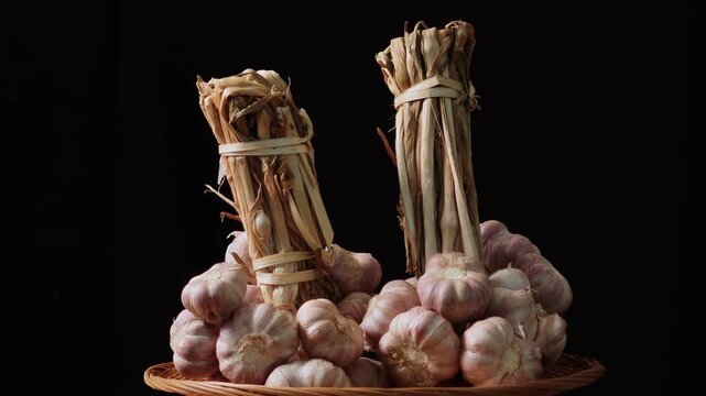 Fresh garlic on a black background.