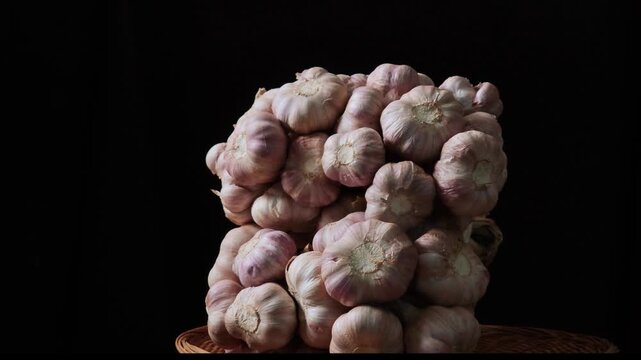 Fresh garlic on a black background.