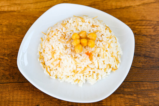 Traditional delicious Turkish food; Turkish style rice pilaf (Turkish name; Arpa sehriyeli. tavuklu, kuru fasulyeli, pirinc pilavi). Cigerli, kavurmali, tereyagli nohut pilav. Pilavustu kuru fasulye.