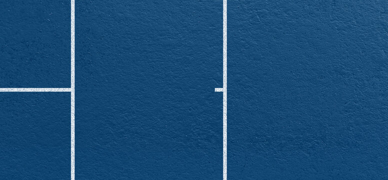 Blue tennis court surface with clear white boundary lines and textured hard court material