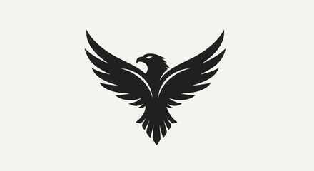 Obraz premium Black eagle silhouette with wings spread against a white background